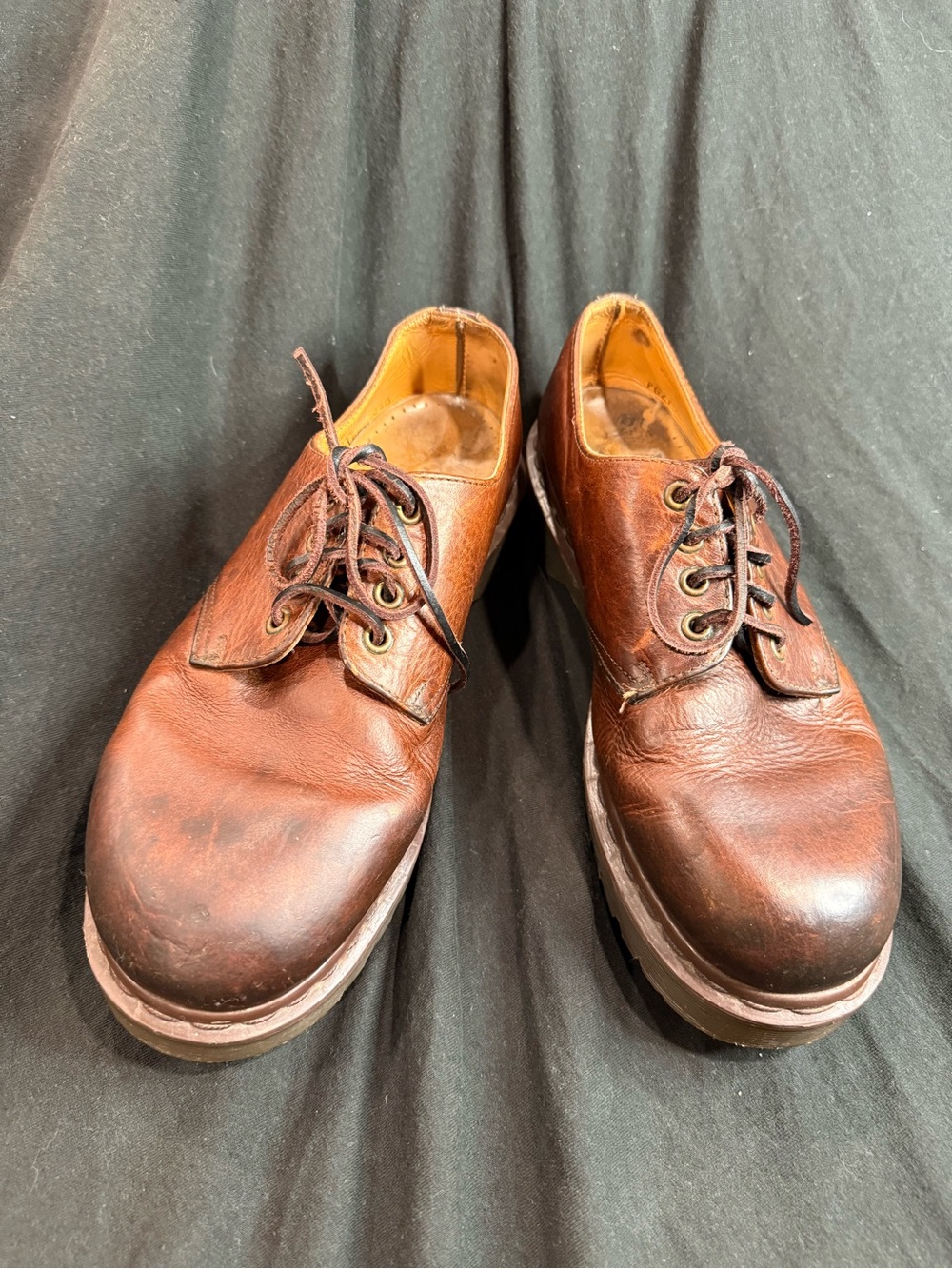 Vintage Dr. Martens Made in England (MIE) brown leather shoes.